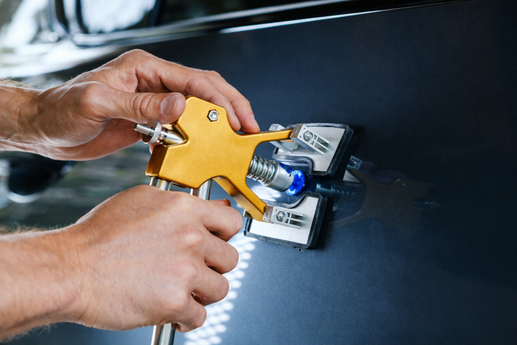 Paintless dent repair process using professional tools.